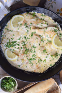 Lemon cream chicken in a skillet.