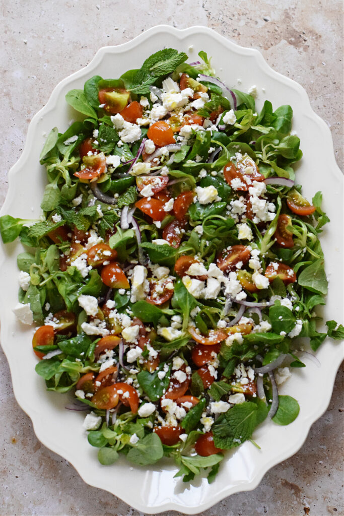 Tomato feta salad on a plate.