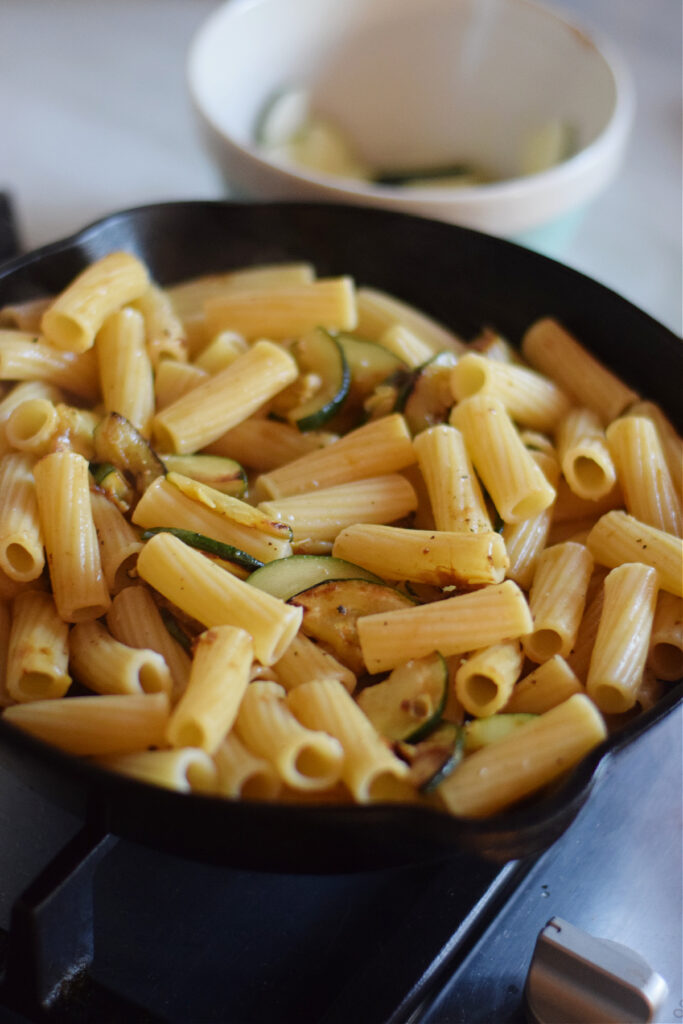 Cooked pasta in a skillet.