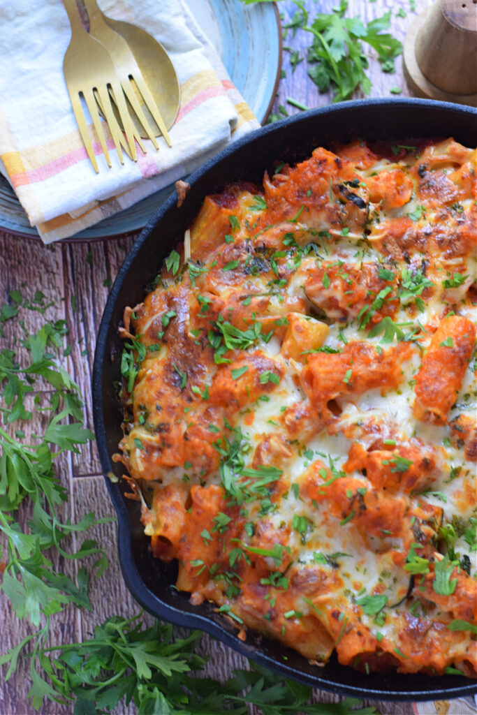 A baked pasta dish in a cast iron skillet.