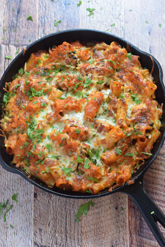 Baked pasta dish in a cast iron dish.
