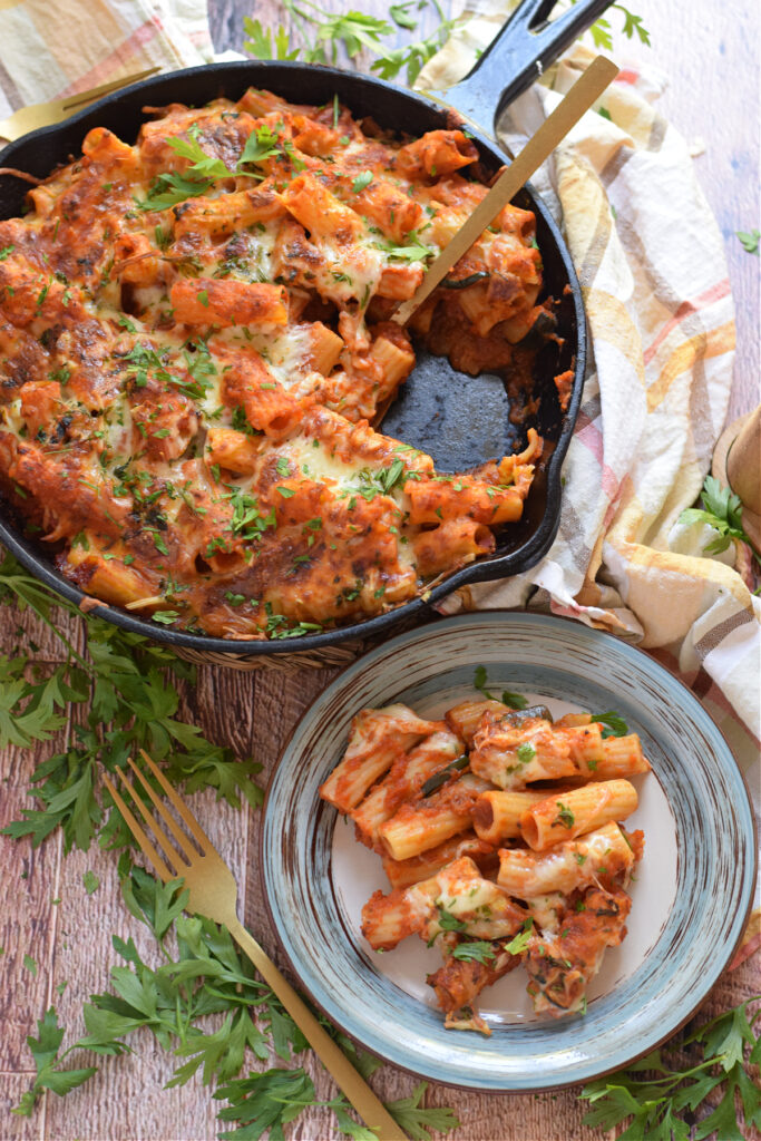 Baked pasta in a serving dish and on a plate.