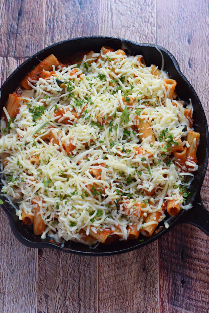 Ready to bake pasta dish in a cast iron skillet.