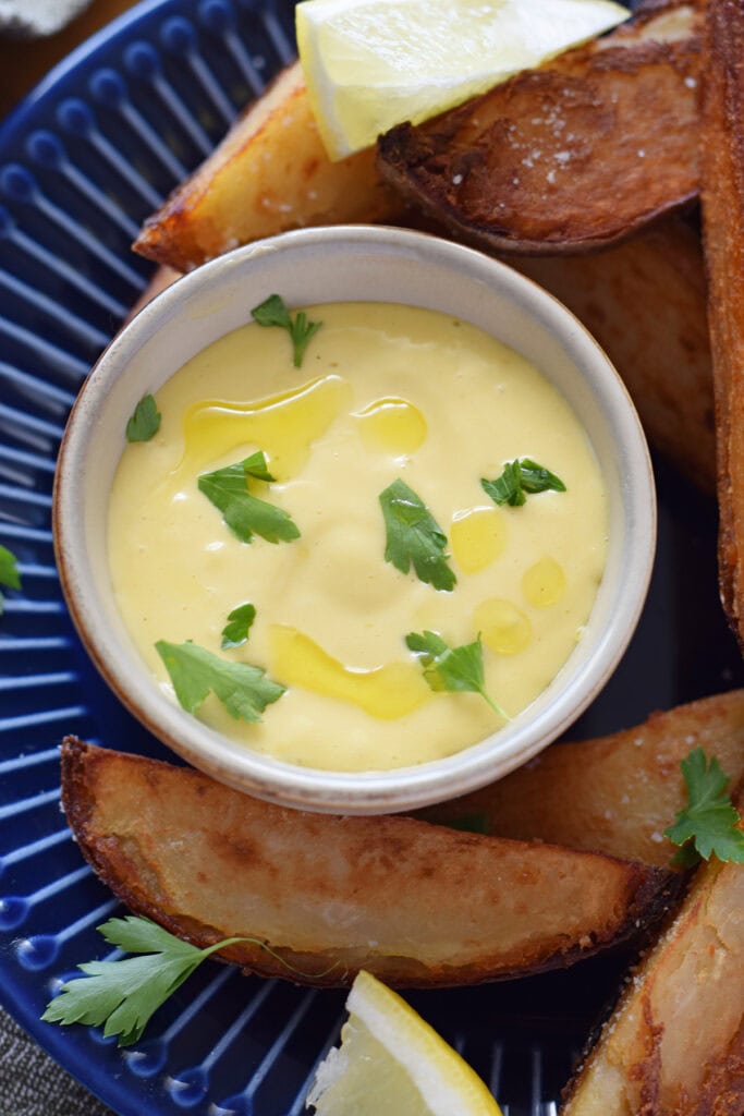 Close up of garlic aioli in a small bowl.