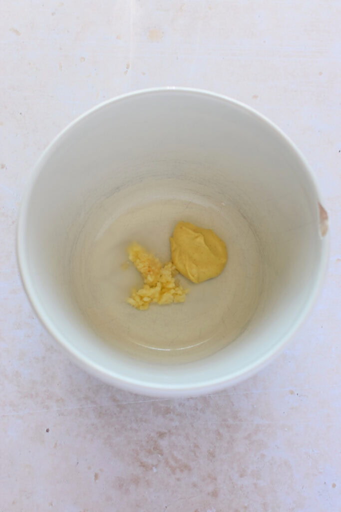 Mustard and garlic in a bowl.