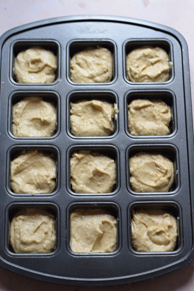 Cake squares in a cake pan.