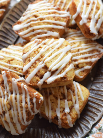 Cinnamon cake squares on a tray.
