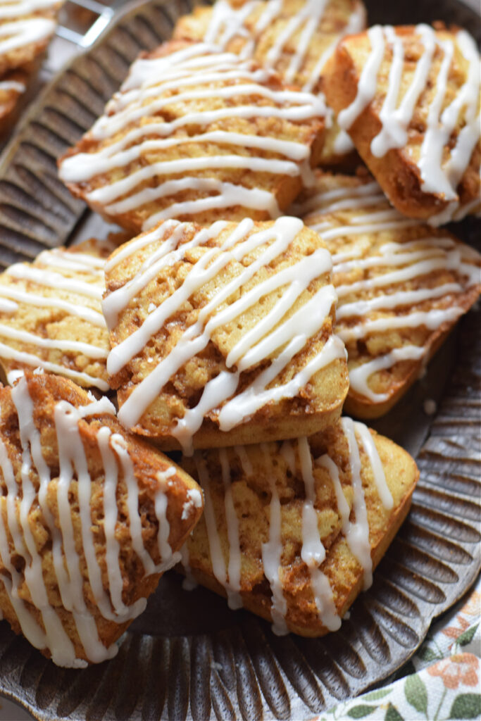 Cinnamon cake squares on a tray.