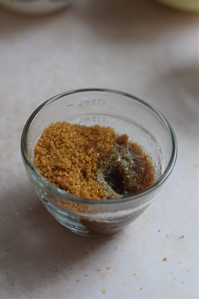 Brown sugar, cinnamon and melted butter in a small glass bowl.