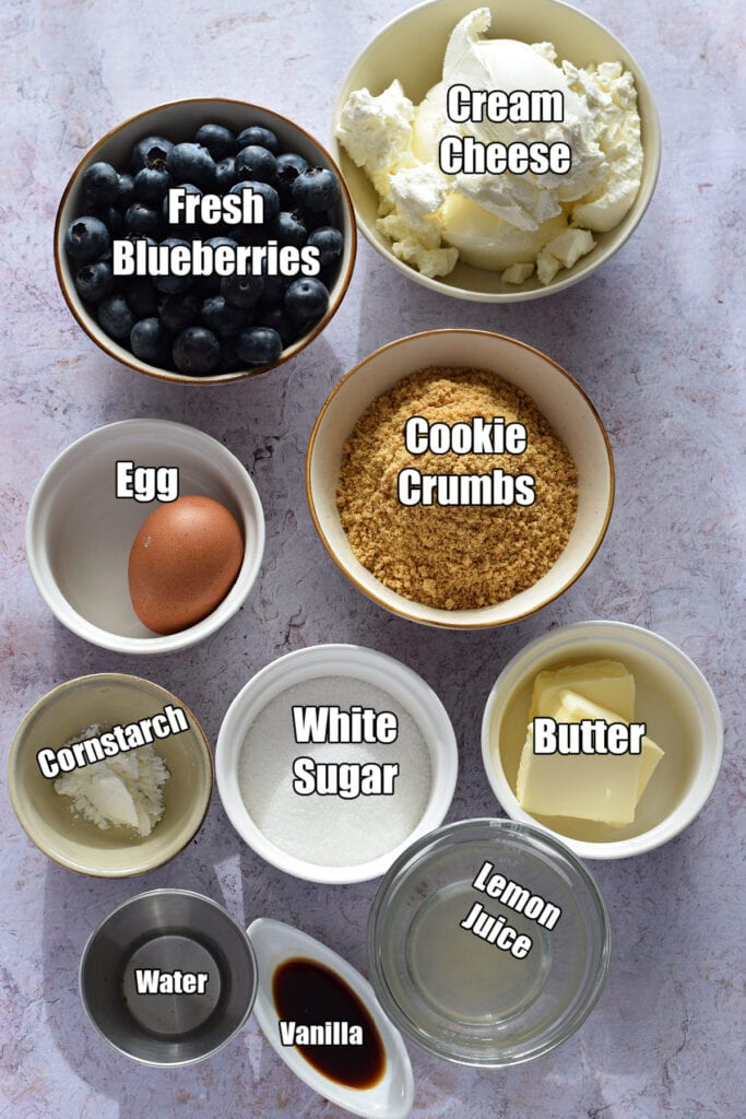 Ingredients to make mini blueberry cheesecakes.