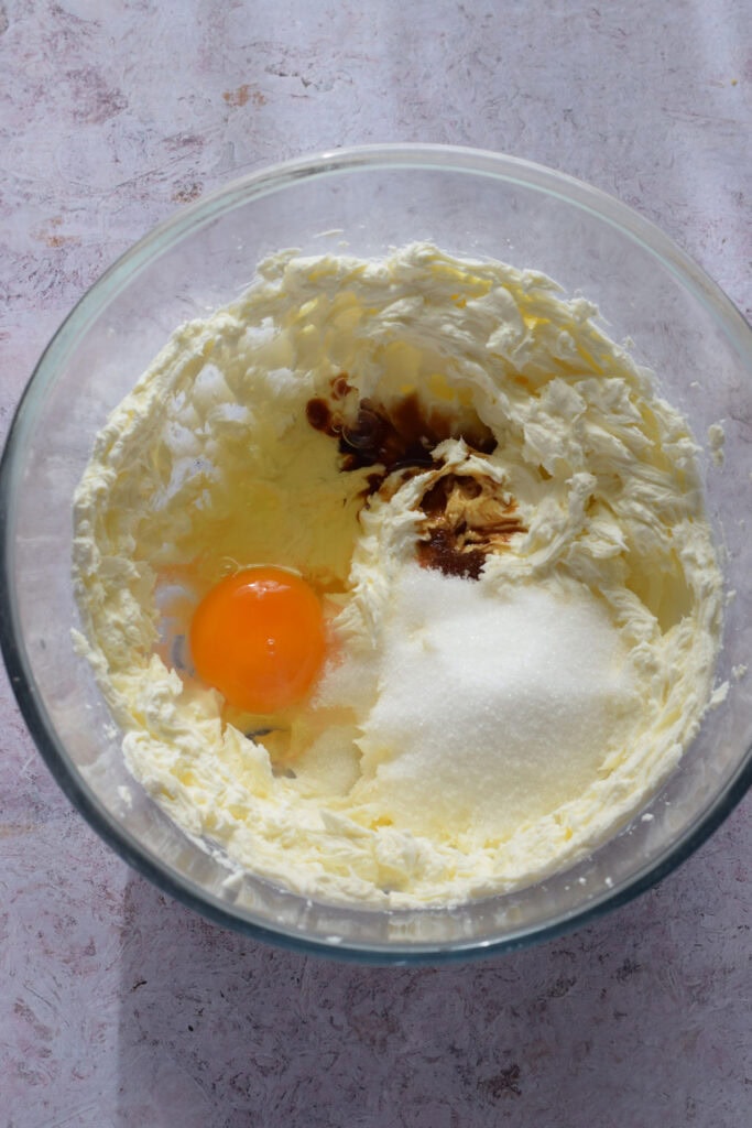 Cheesecake ingredients in a glass bowl.