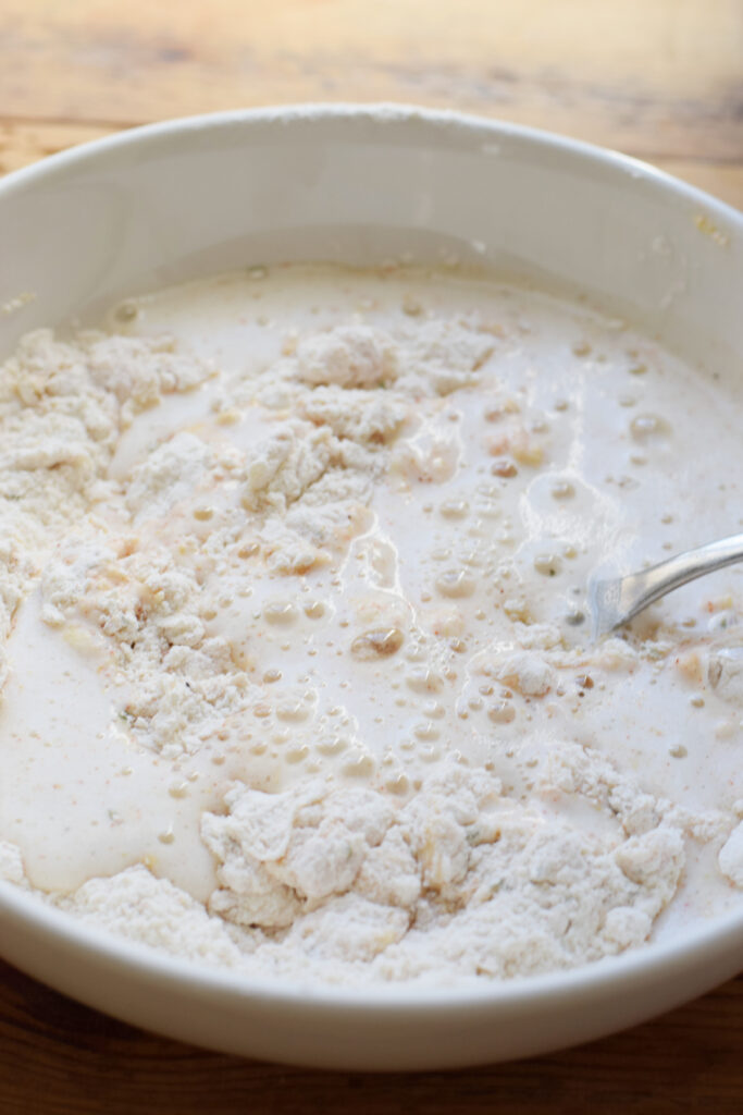 Making beer batter for onion rings.