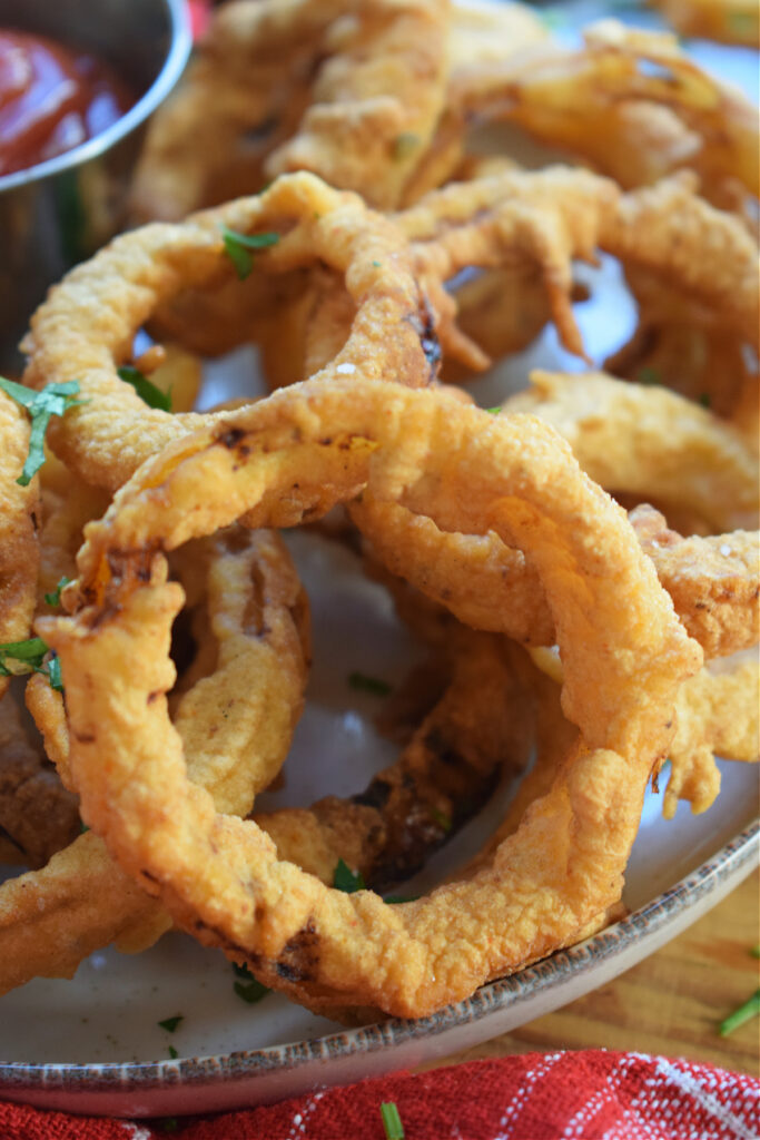 Close up of crispy fried onion rings.