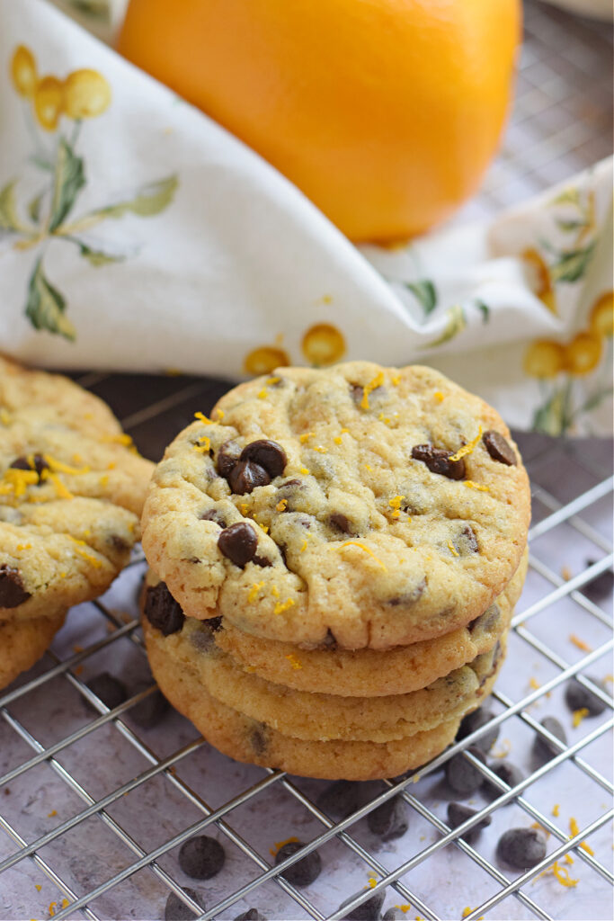A stack of orange chocolate chip cookies.l