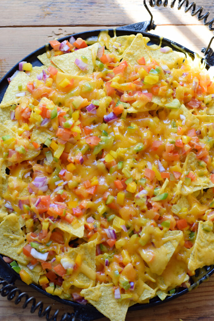 Baked vegetable nachos on a platter.