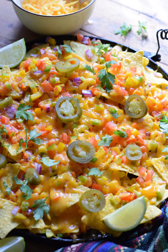 Close up of veggie nachos on a plate.