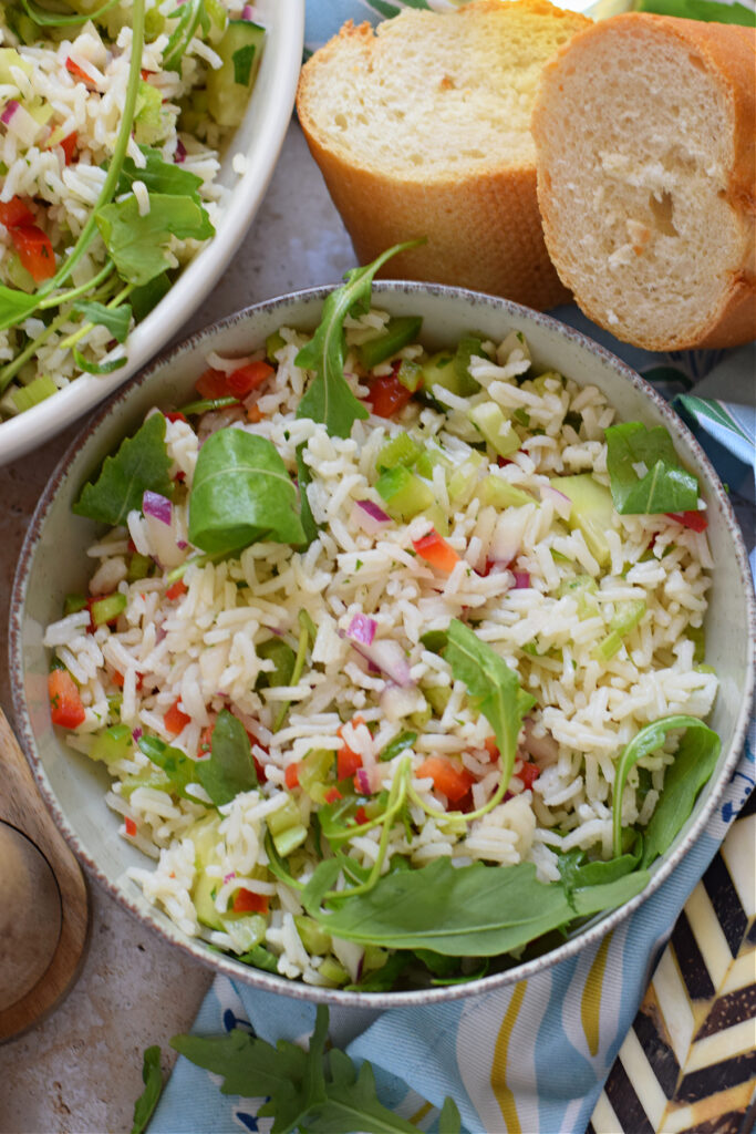 Close up of vegetable rice salad in a bowl.