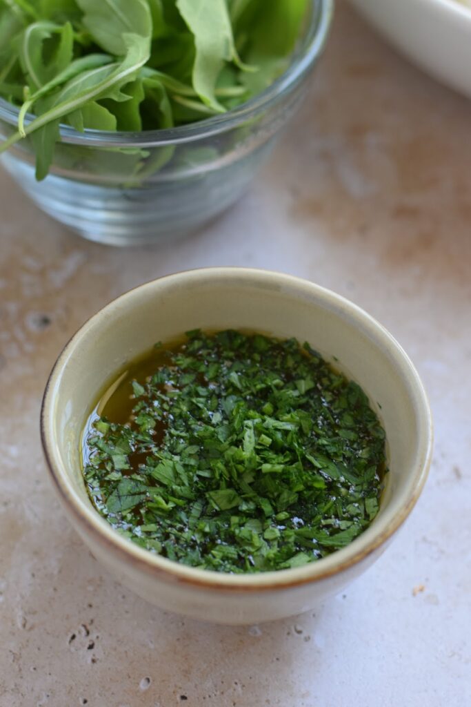 Making a vinaigrette in a bowl.