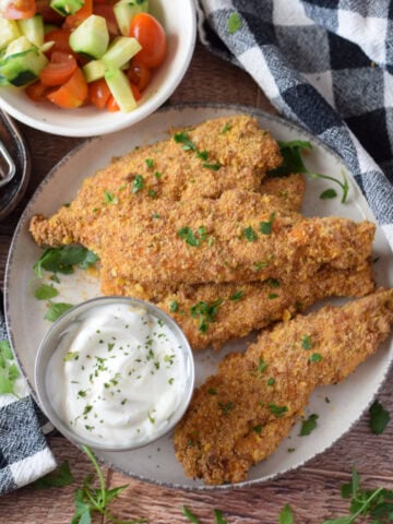 Cajun chicken tenders on a plate.