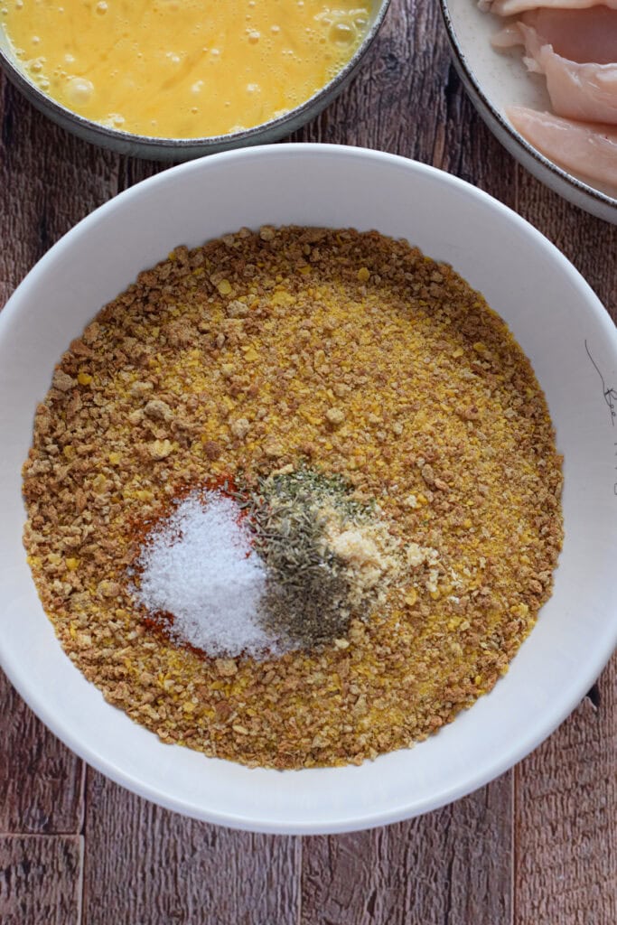 Combine cajun seasoning with bread crumbs.