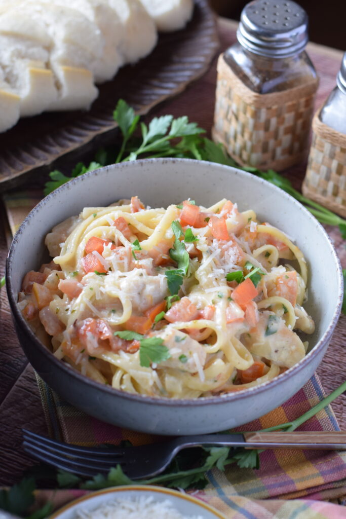 Close up of creamy chicken and pasta.