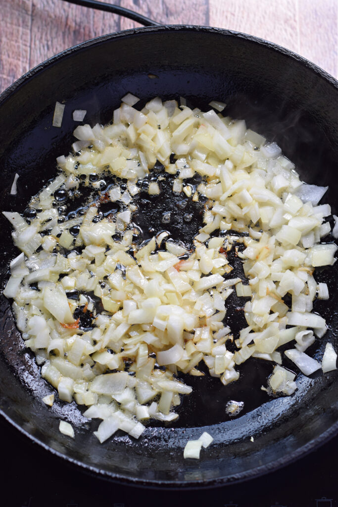 Cooking onions in a skillet.