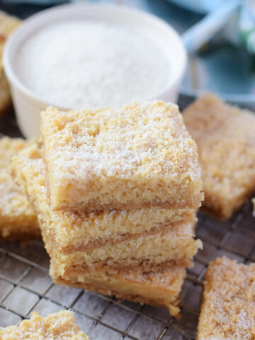 A stack of coconut cookies on a tray.