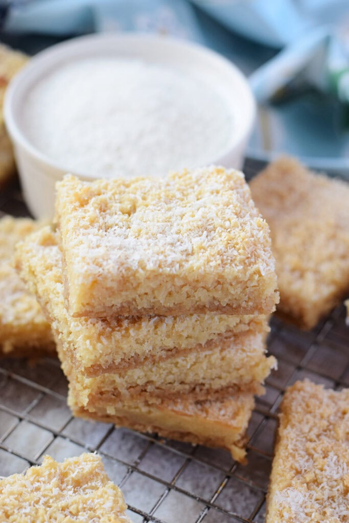 A stack of coconut cookies on a tray.