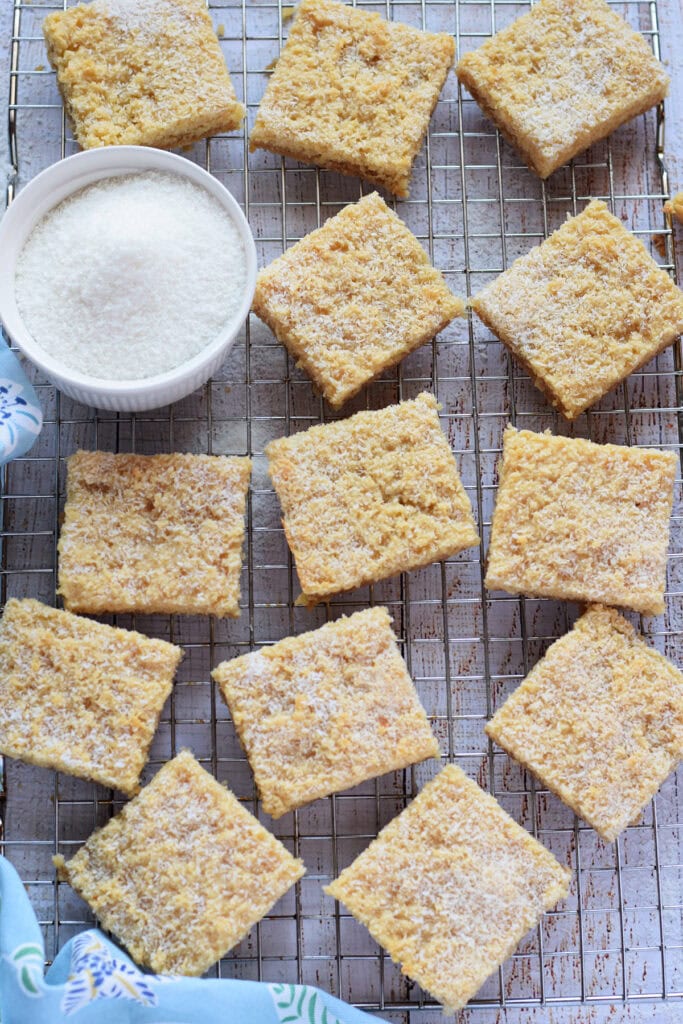 Coconut bars on a cooling rack.