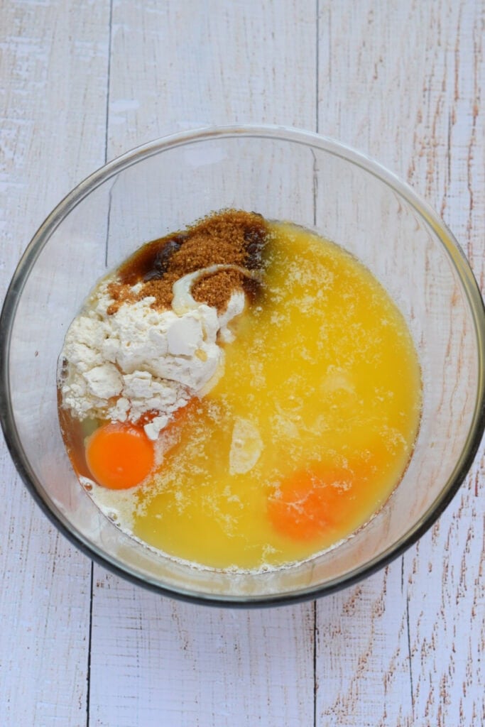 Ingredients in a glass bowl to make a cookie bar filling.