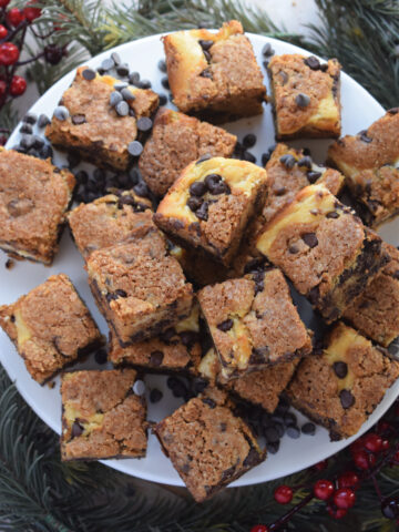 Cream cheese cookie bars on a plate.