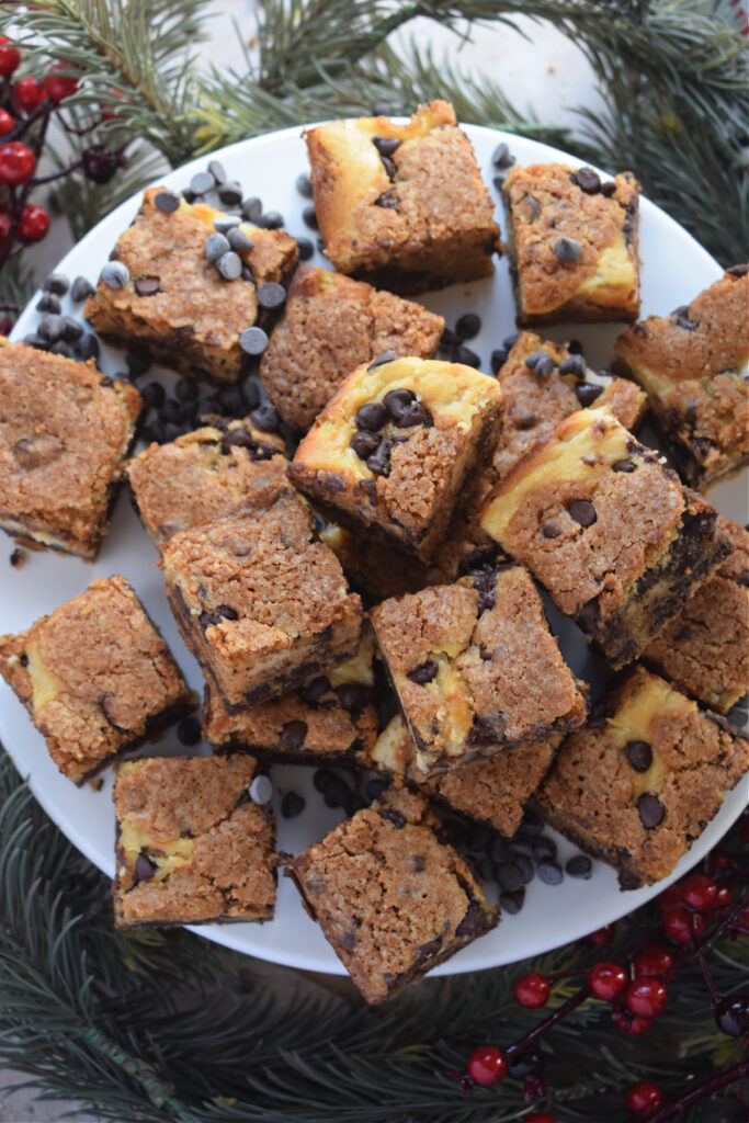 Cream cheese cookie bars on a plate.