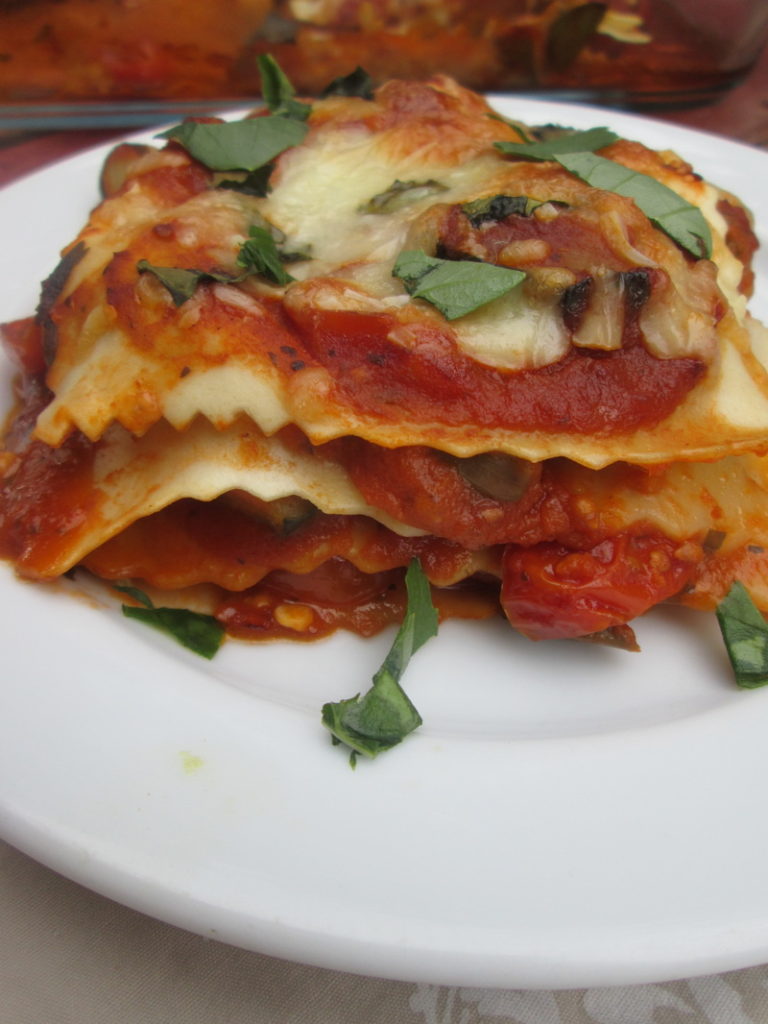close up of the roasted cherry tomato and zucchini lasagna on a plate
