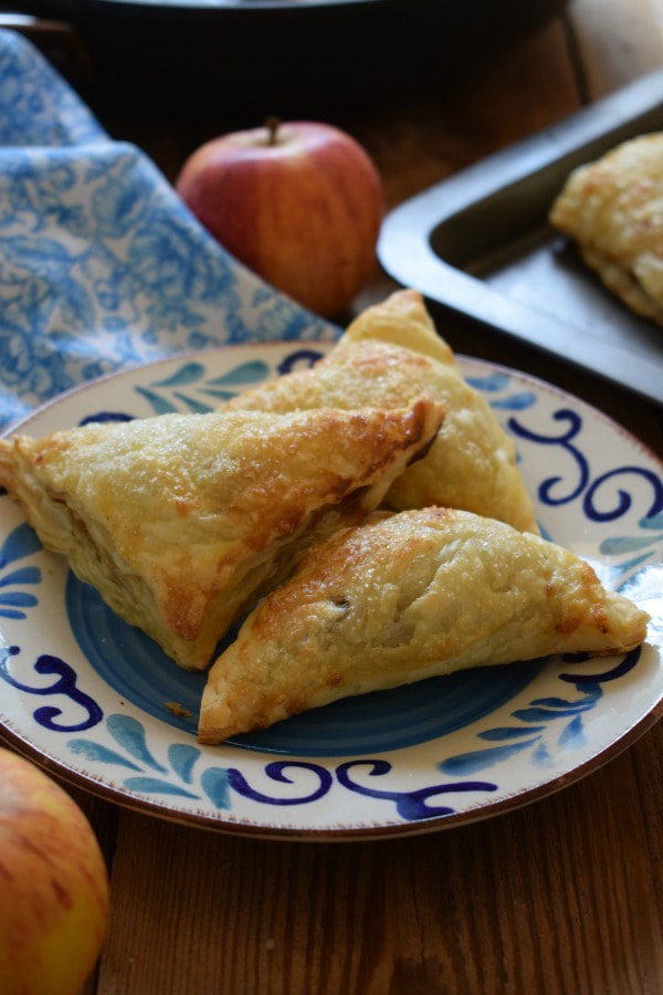 apple turnovers on a patterned blue plate