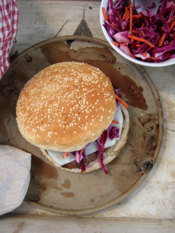 overhead view of a burger on a rustic plate