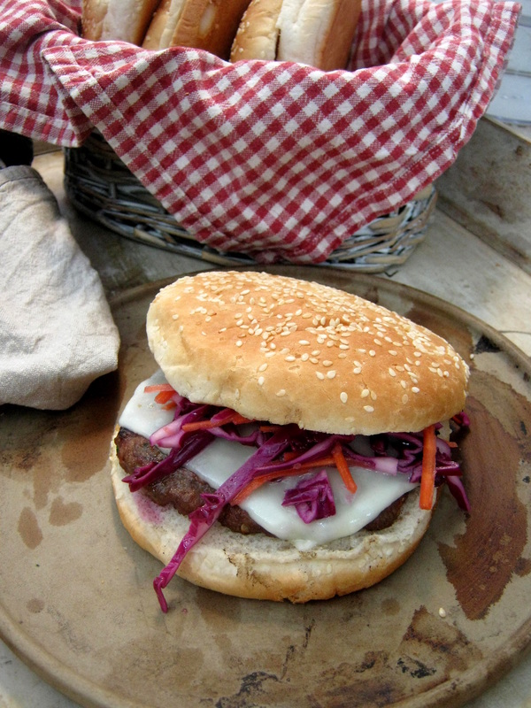 Burgers with a Red Cabbage & Carrot Slaw on a rustic plate