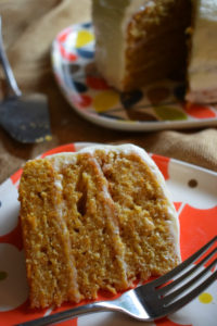 a slice of the cream cheese frosted carrot cake on a plate