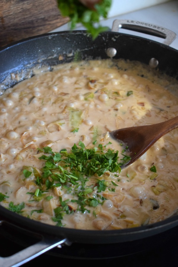 Sauce in a skillet for a chicken pie.