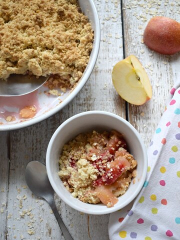 apple and raspberry crisp in a serving dish