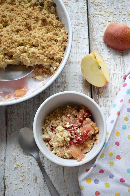 apple and raspberry crisp in a serving dish 