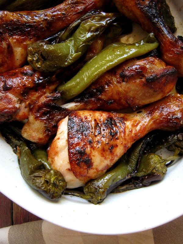 close up of chicken drumsticks and green peppers