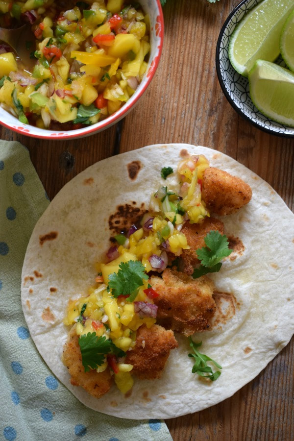Over head close up view of the fish tacos with a spicy mango salsa