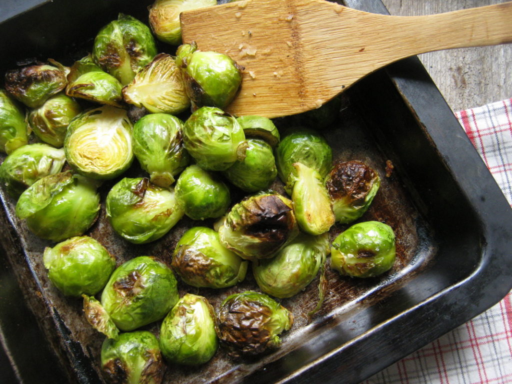 roasted garlic brussel sprouts in a baking dish