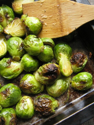 roasted garlic brussel sprouts in a baking dish