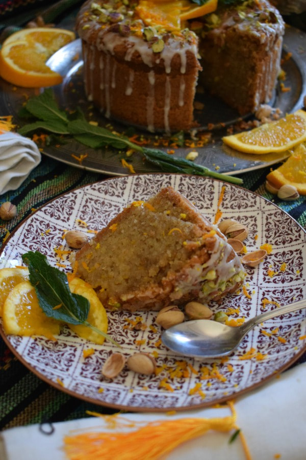 a slice of orange and almond cake on a plate.
