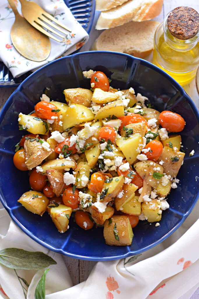 Potato and Feta salad in a blue bowl.
