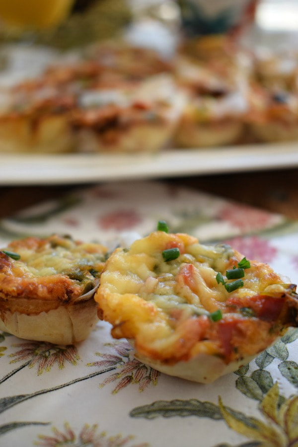 Close up of mini quiche on a plate.