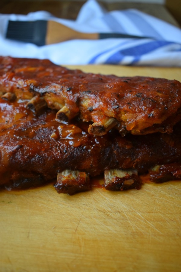 RIBS STACKED ON A WOODEN BOARD