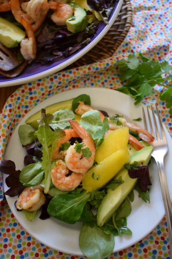 Over head view of the Tropical Shrimp Salad on a plate with a table setting