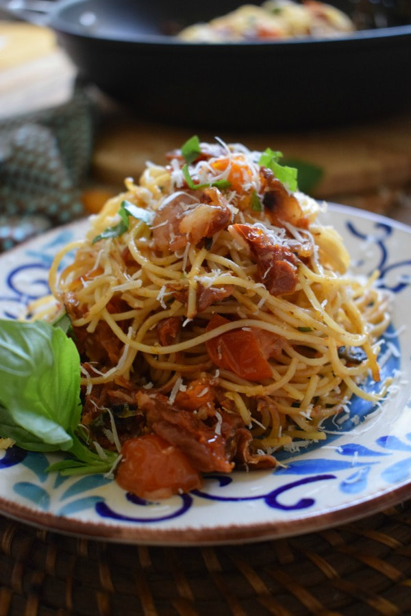 spaghetti piled high on a serving plate